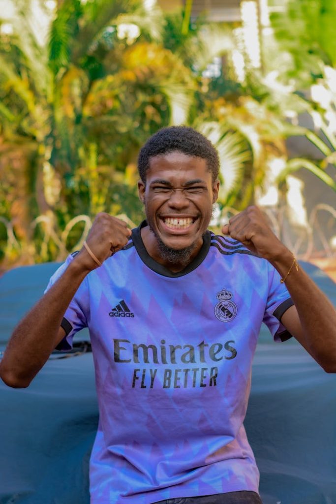 Portrait of an African Man Wearing Football Shirt